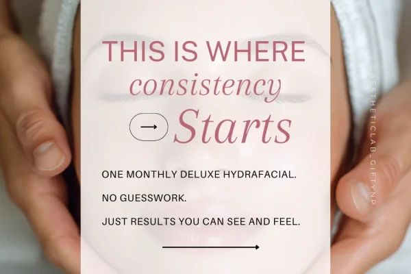 Woman holding a paper reading "This is where your glow starts" during an aesthetic consultation in Modesto, CA