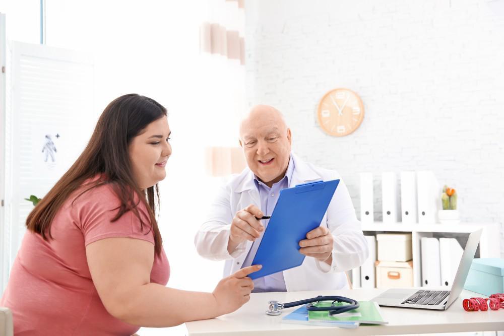 image of a doctor speaking with his patient