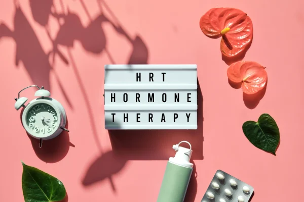 Bioidentical hormone replacement therapy (HRT) letters spelled out on letterboard with pink flowers in Modesto, CA.
